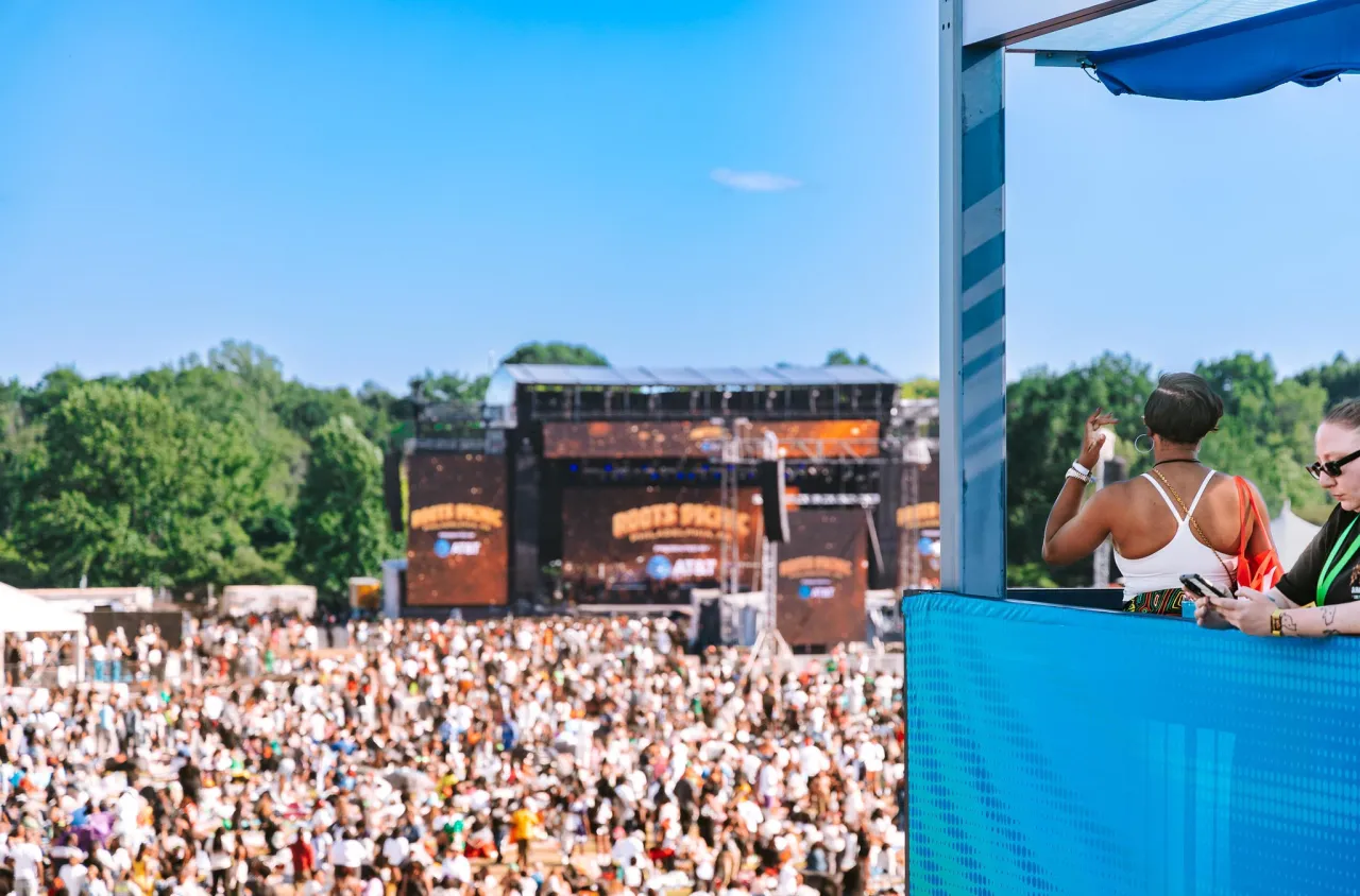 View across the Roots Picnic crowd toward the festival stage from the AT&T activation.