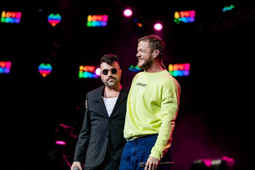 Tyler Glenn and Dan Reynolds on stage at LOVELOUD SLC 2023