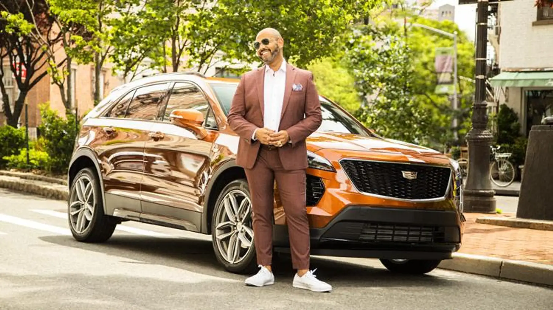 Master of Style editorial photography with the Cadillac XT4 on a city street.