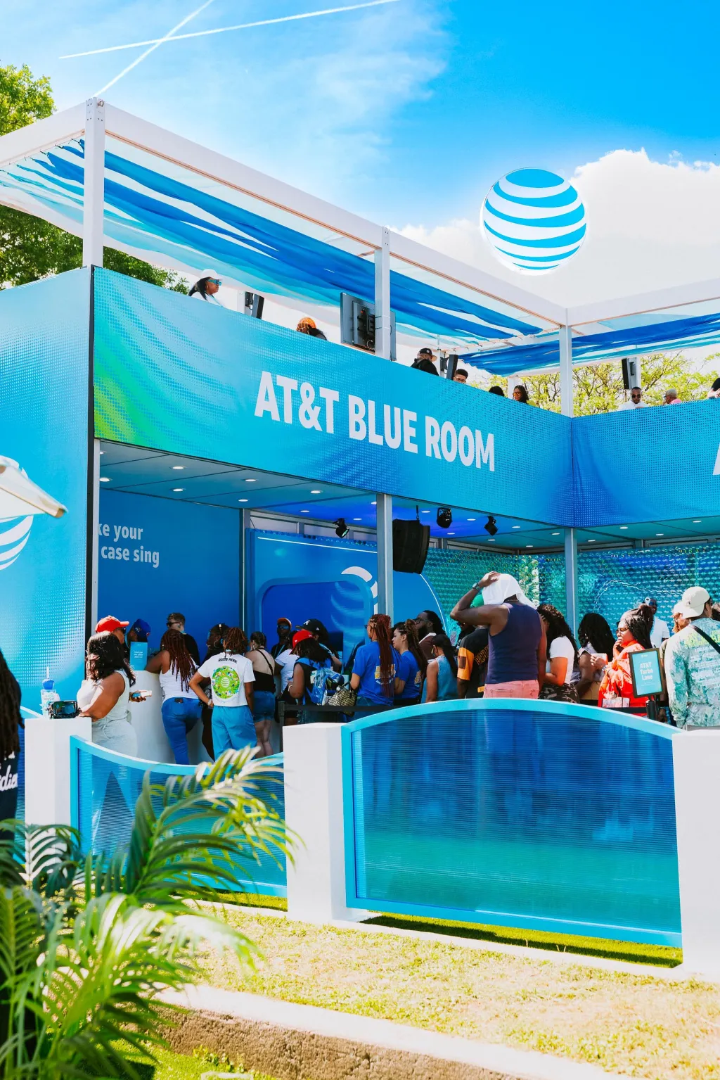 Crowds gathering at the vivid blue AT&T Blue Room at Roots Picnic.