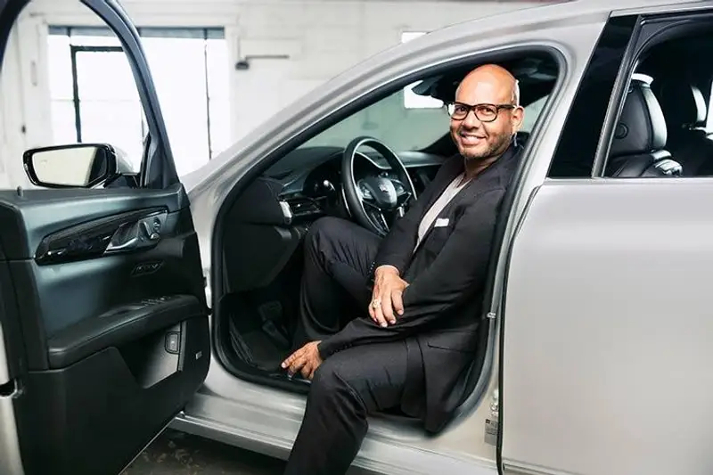 Emil Wilbekin seated in a Cadillac, 2017 Master of Style.